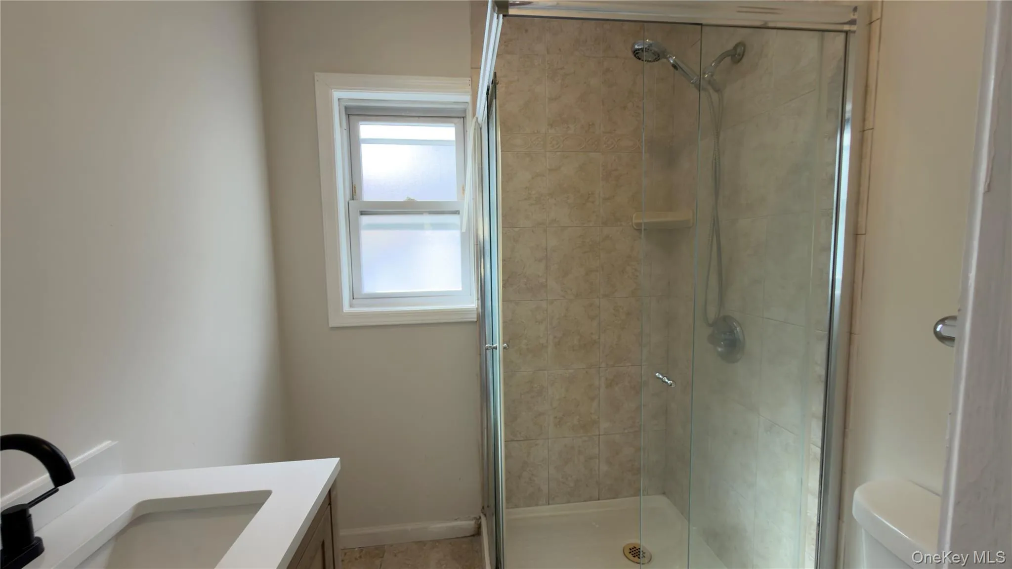 Full bathroom featuring vanity and a shower stall Full bathroom featuring vanity and a shower stall