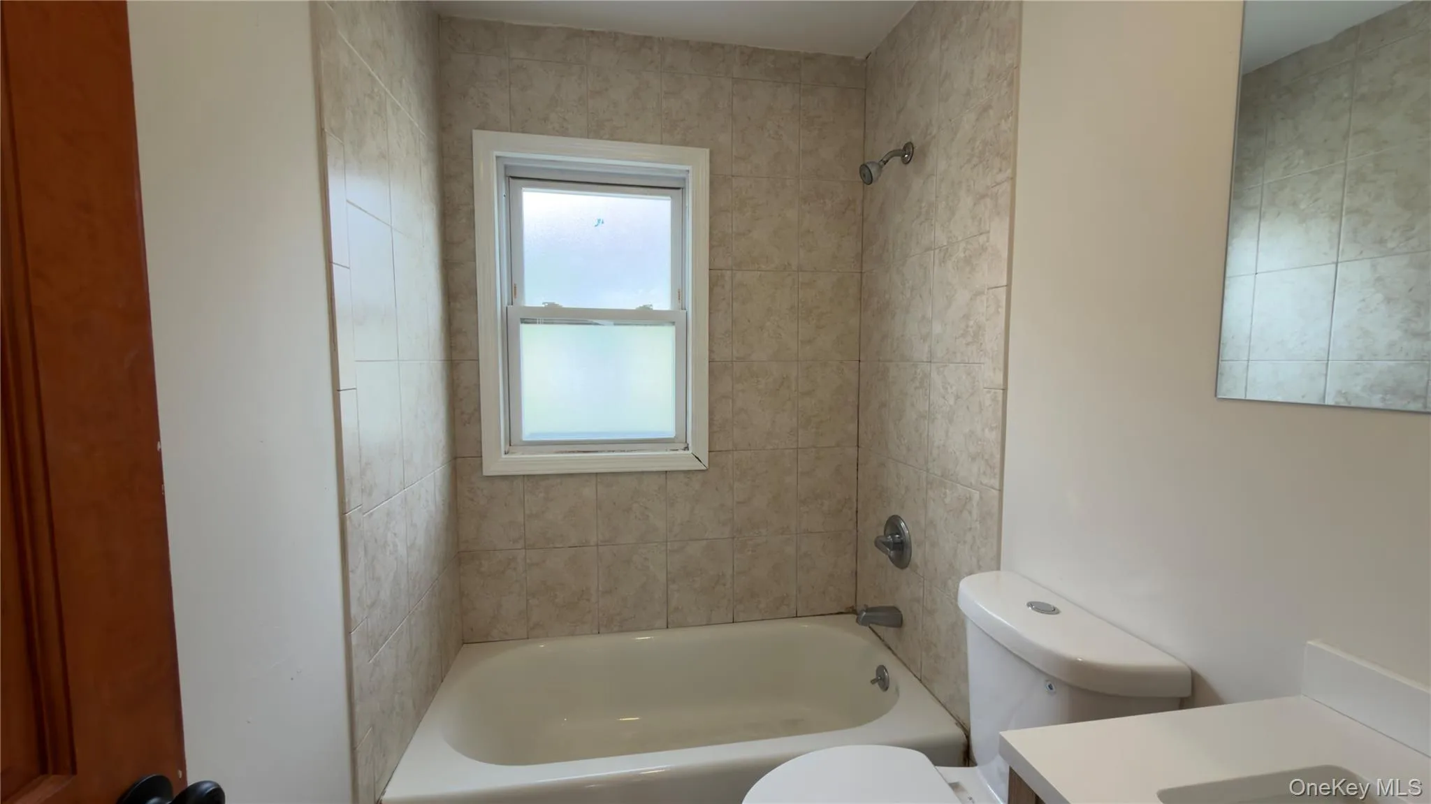 Bathroom with washtub / shower combination and vanity Bathroom with washtub / shower combination and vanity