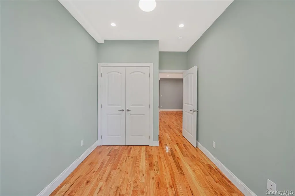 Unfurnished bedroom featuring light wood-style flooring, recessed lighting, and a closet Unfurnished bedroom featuring light wood-style flooring, recessed lighting, and a closet