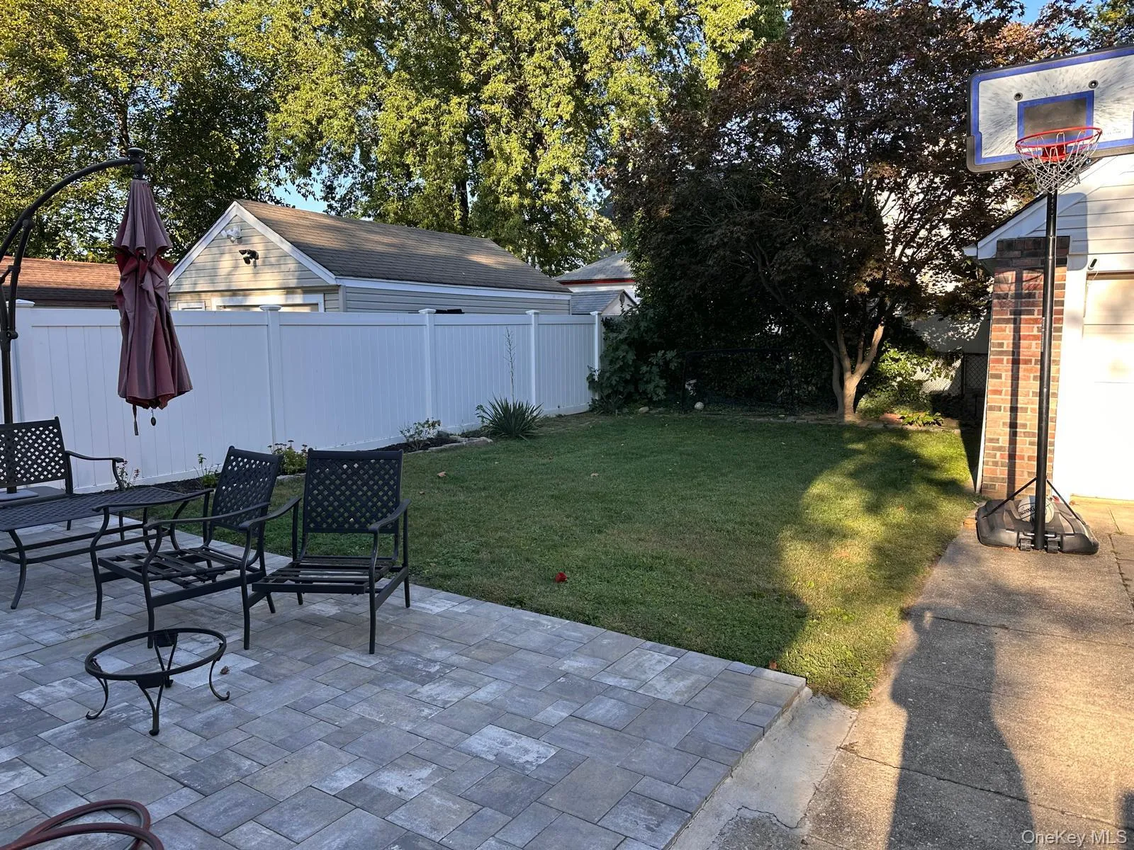 Fenced backyard featuring a patio area and outdoor dining space Fenced backyard featuring a patio area and outdoor dining space
