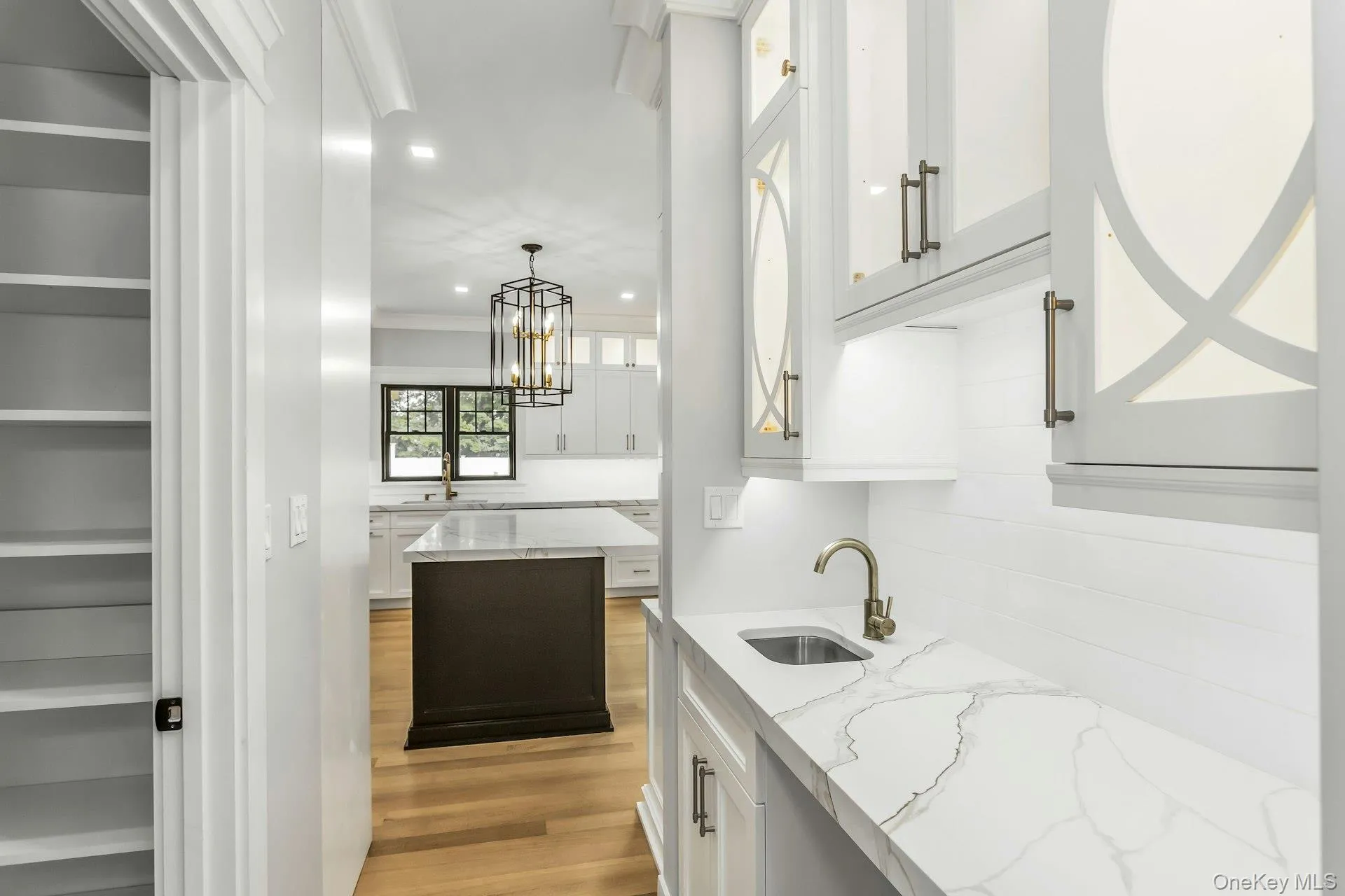 Bar area with white cabinetry, light stone countertops, recessed lighting, crown molding, and light wood-style flooring Bar area with white cabinetry, light stone countertops, recessed lighting, crown molding, and light wood-style flooring