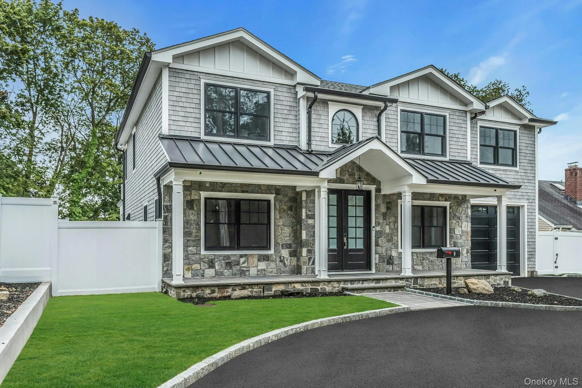 View of front of property with a standing seam roof, a metal roof, covered porch, and board and batten siding View of front of property with a standing seam roof, a metal roof, covered porch, and board and batten siding
