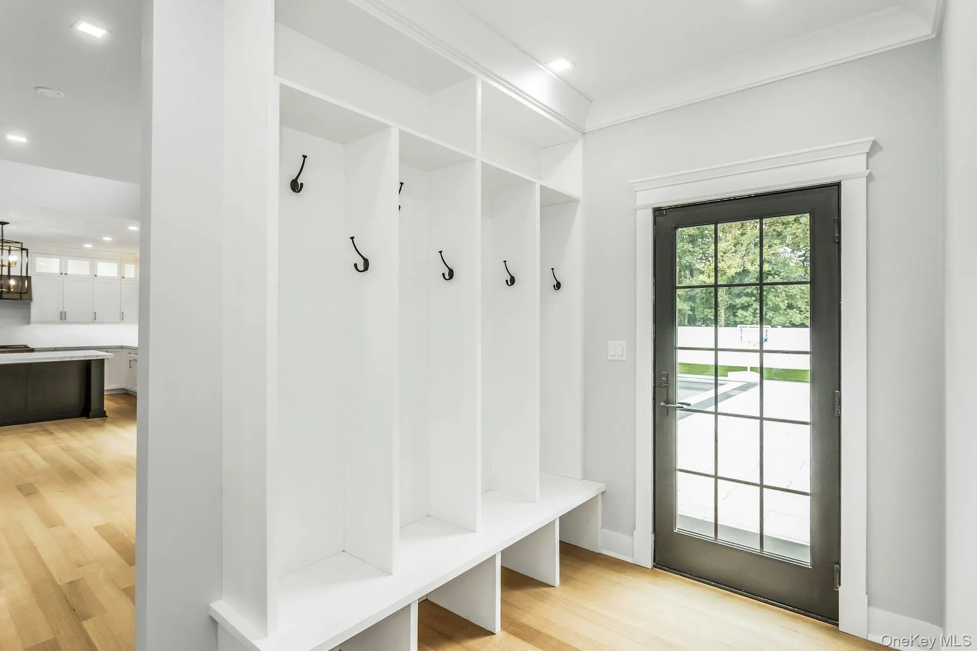 Mudroom featuring light wood-style flooring and recessed lighting Mudroom featuring light wood-style flooring and recessed lighting