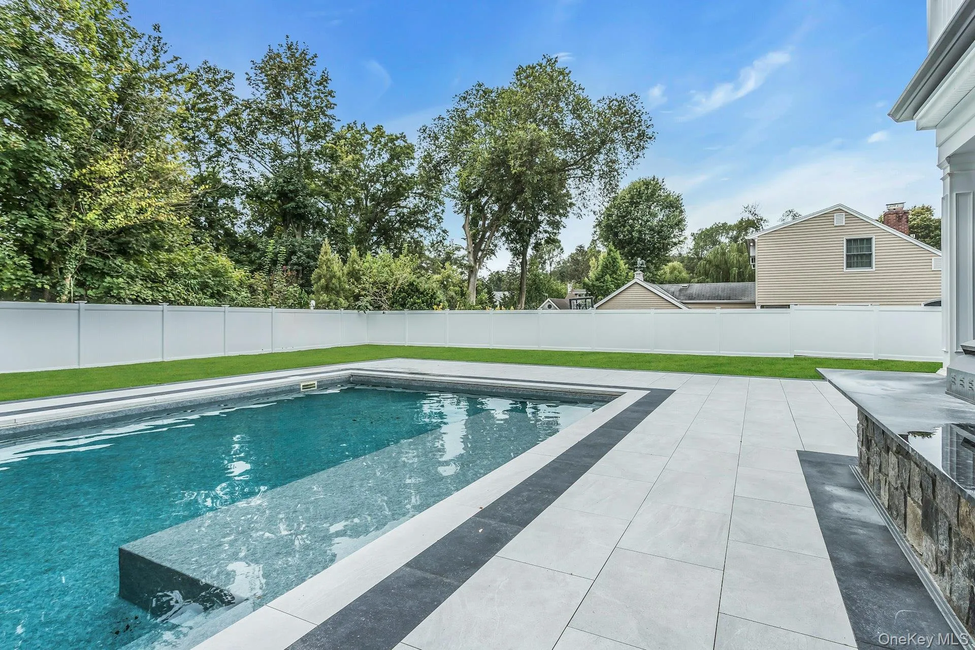 View of pool featuring a fenced backyard and a patio View of pool featuring a fenced backyard and a patio
