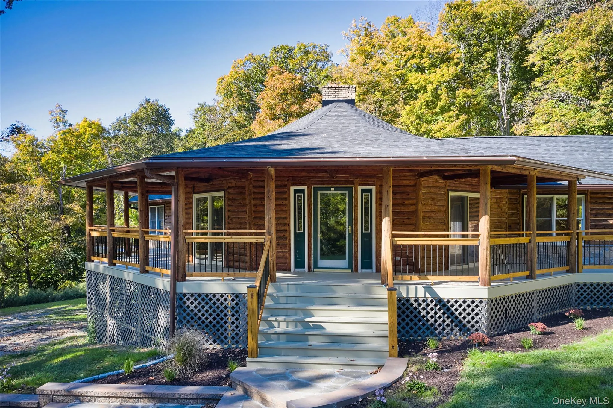View of front of property featuring covered porch, a shingled roof, and a chimney View of front of property featuring covered porch, a shingled roof, and a chimney