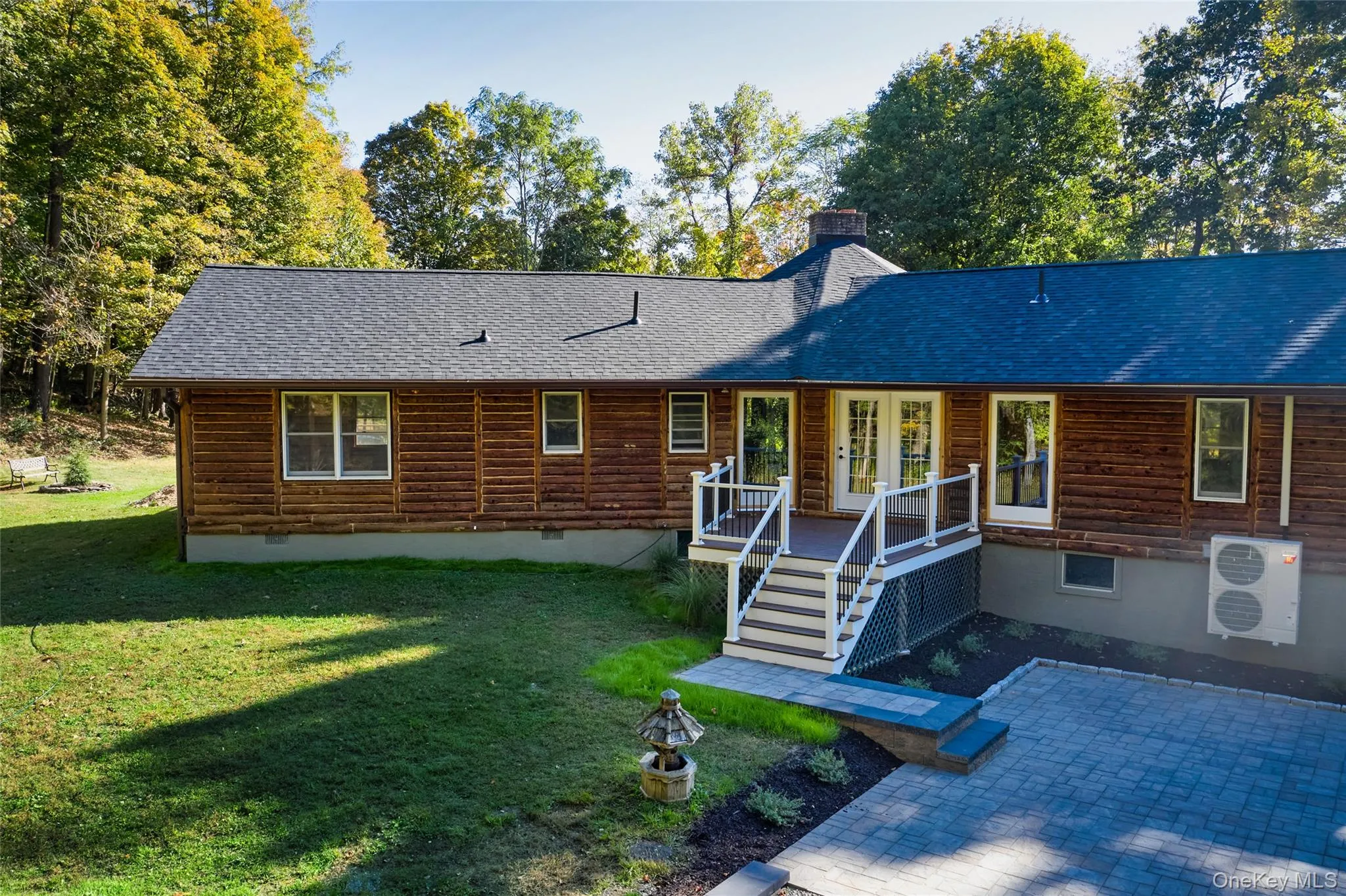 View of front of house with crawl space, a chimney, a shingled roof, a front yard, and a deck View of front of house with crawl space, a chimney, a shingled roof, a front yard, and a deck