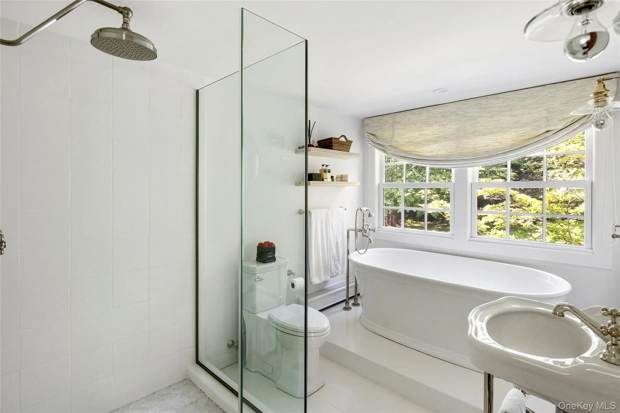 Full bathroom featuring a shower stall, a soaking tub, and tile patterned floors Full bathroom featuring a shower stall, a soaking tub, and tile patterned floors