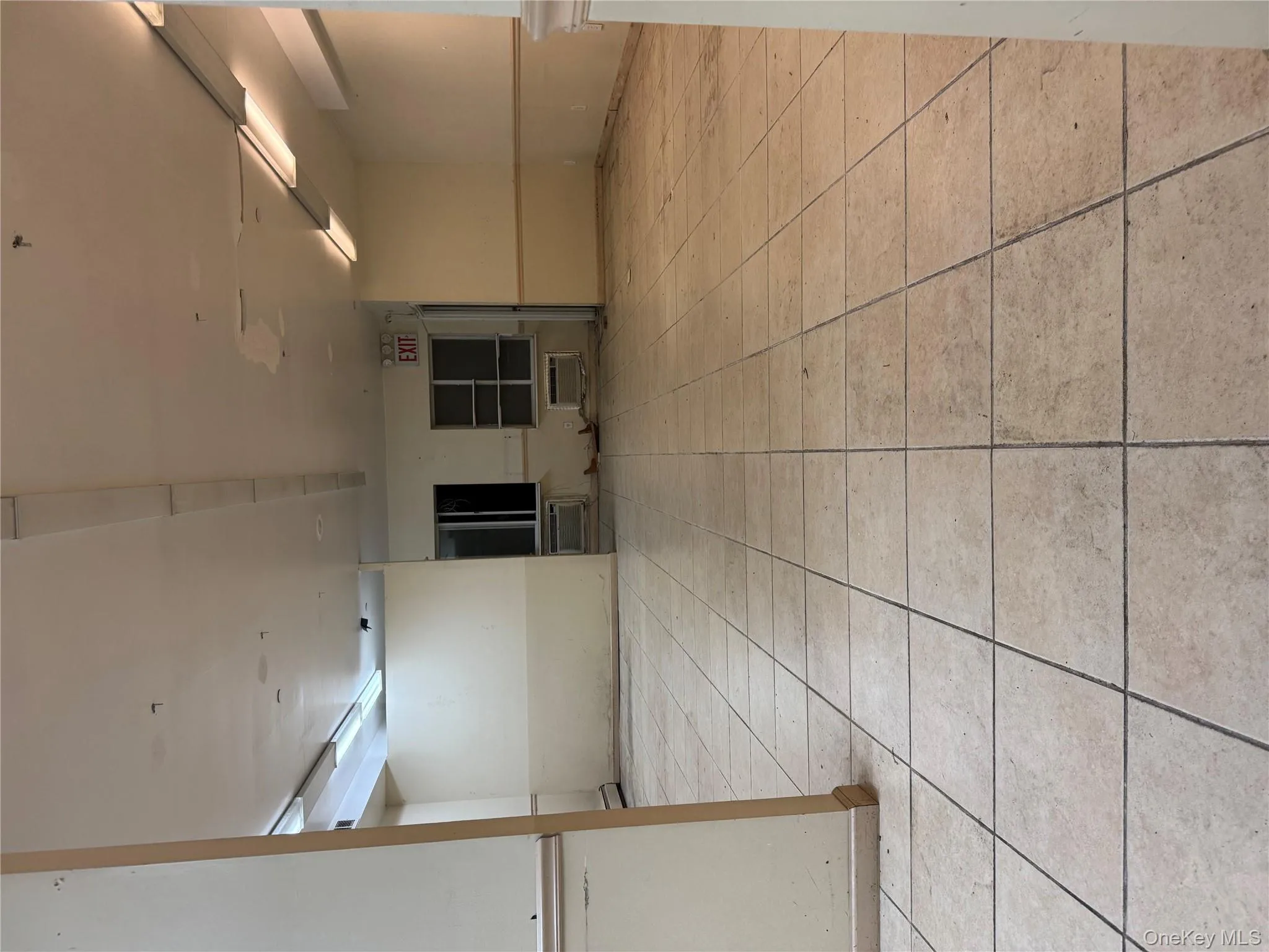 Empty room featuring light tile patterned floors Empty room featuring light tile patterned floors