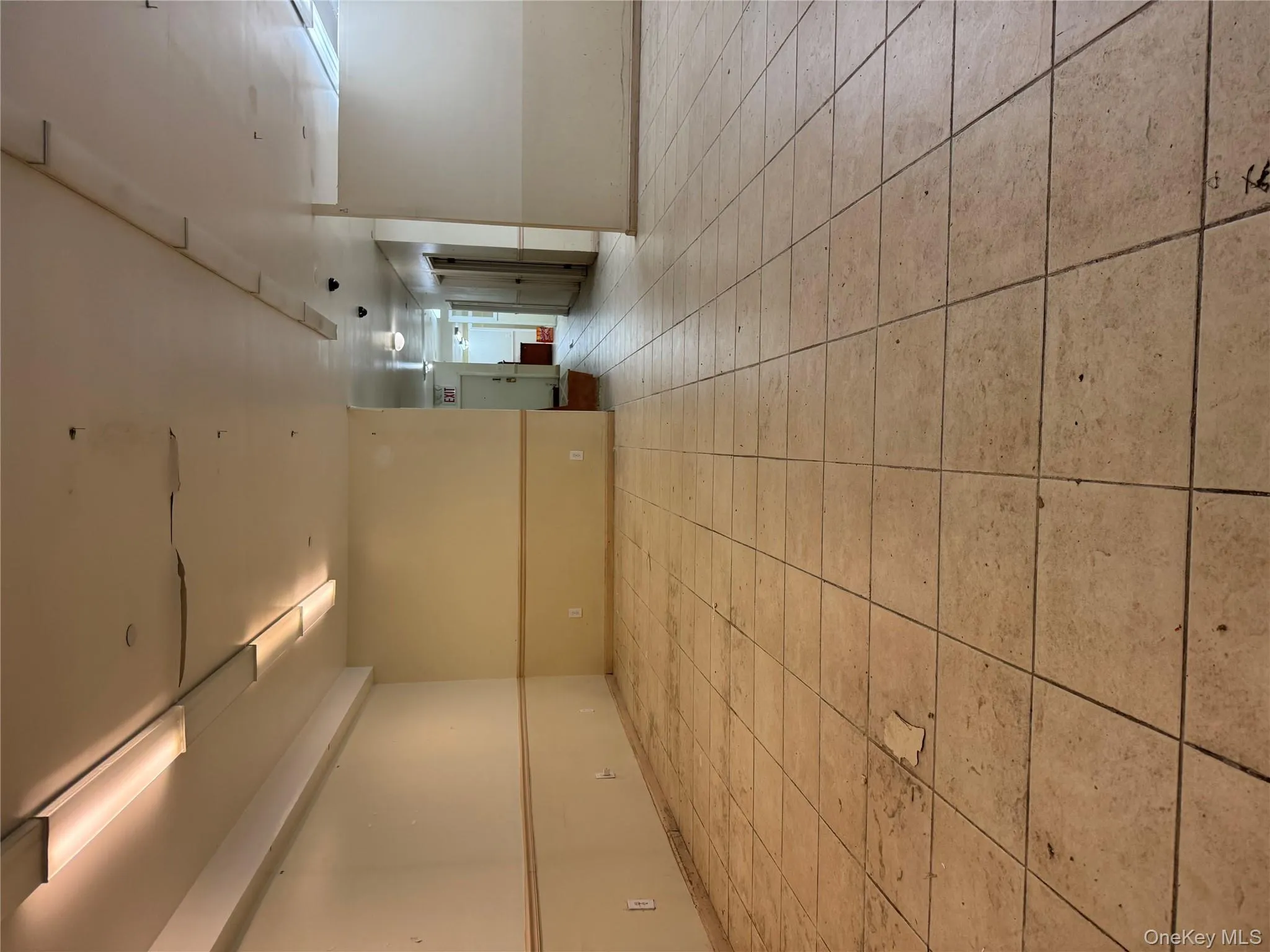 Unfurnished room featuring baseboards and light tile patterned floors Unfurnished room featuring baseboards and light tile patterned floors