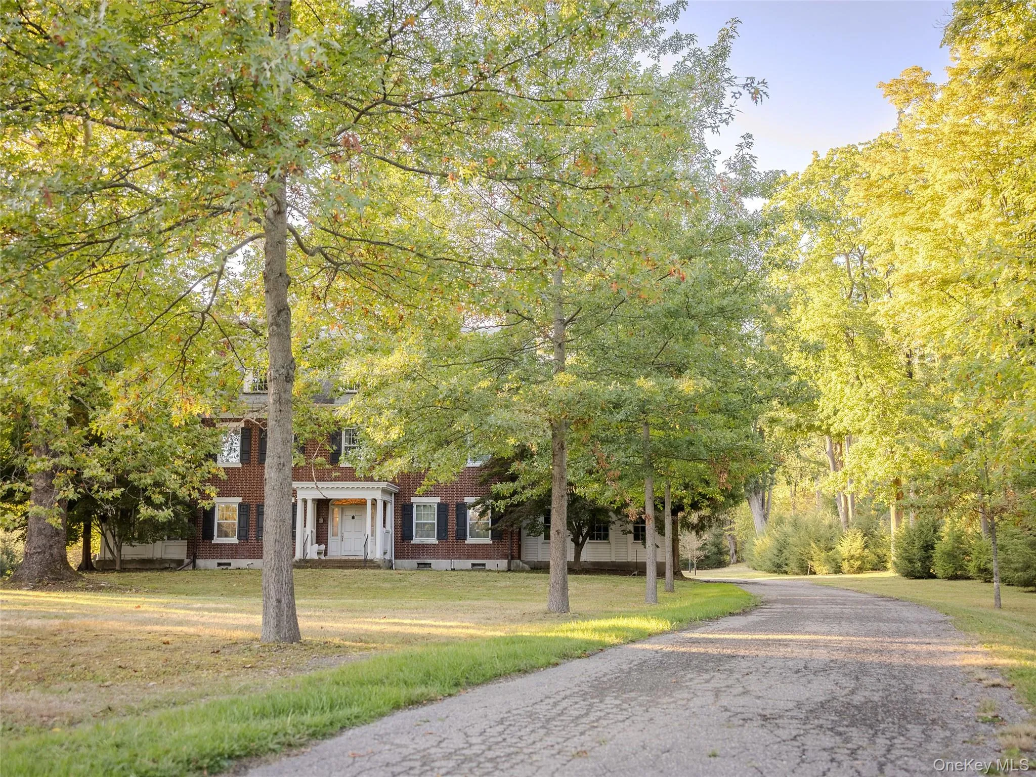 View of front of house featuring a front yard, crawl space, and brick siding View of front of house featuring a front yard, crawl space, and brick siding