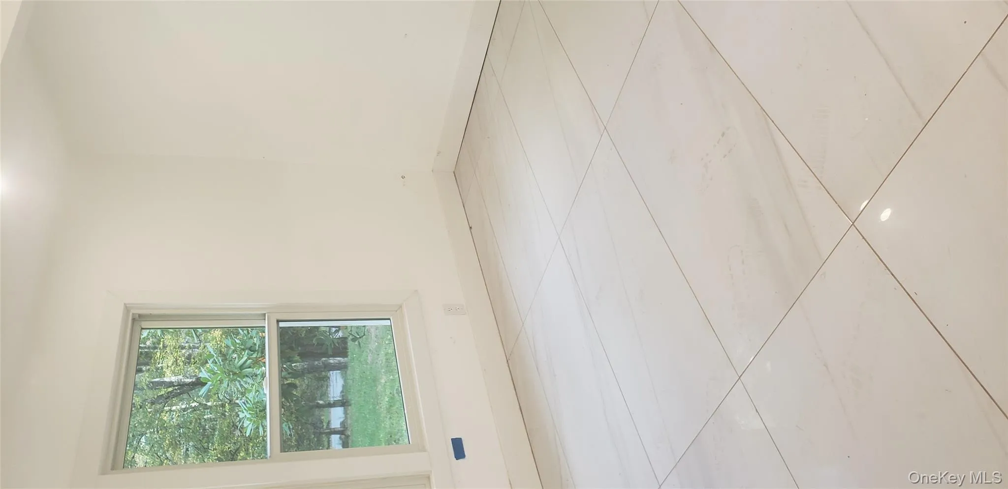 Spare room featuring tile patterned floors and recessed lighting Spare room featuring tile patterned floors and recessed lighting