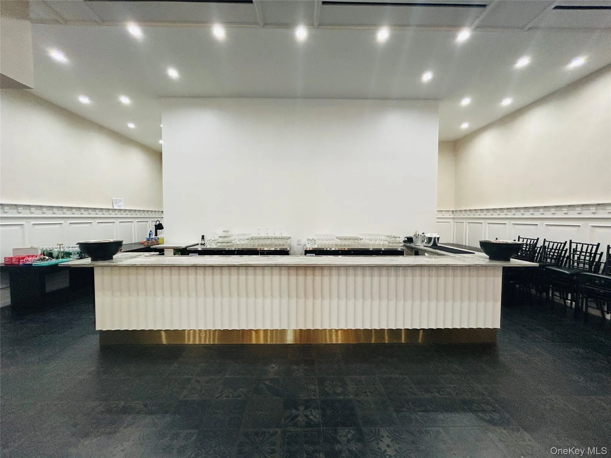 Misc room with a decorative wall, a wainscoted wall, and recessed lighting Misc room with a decorative wall, a wainscoted wall, and recessed lighting