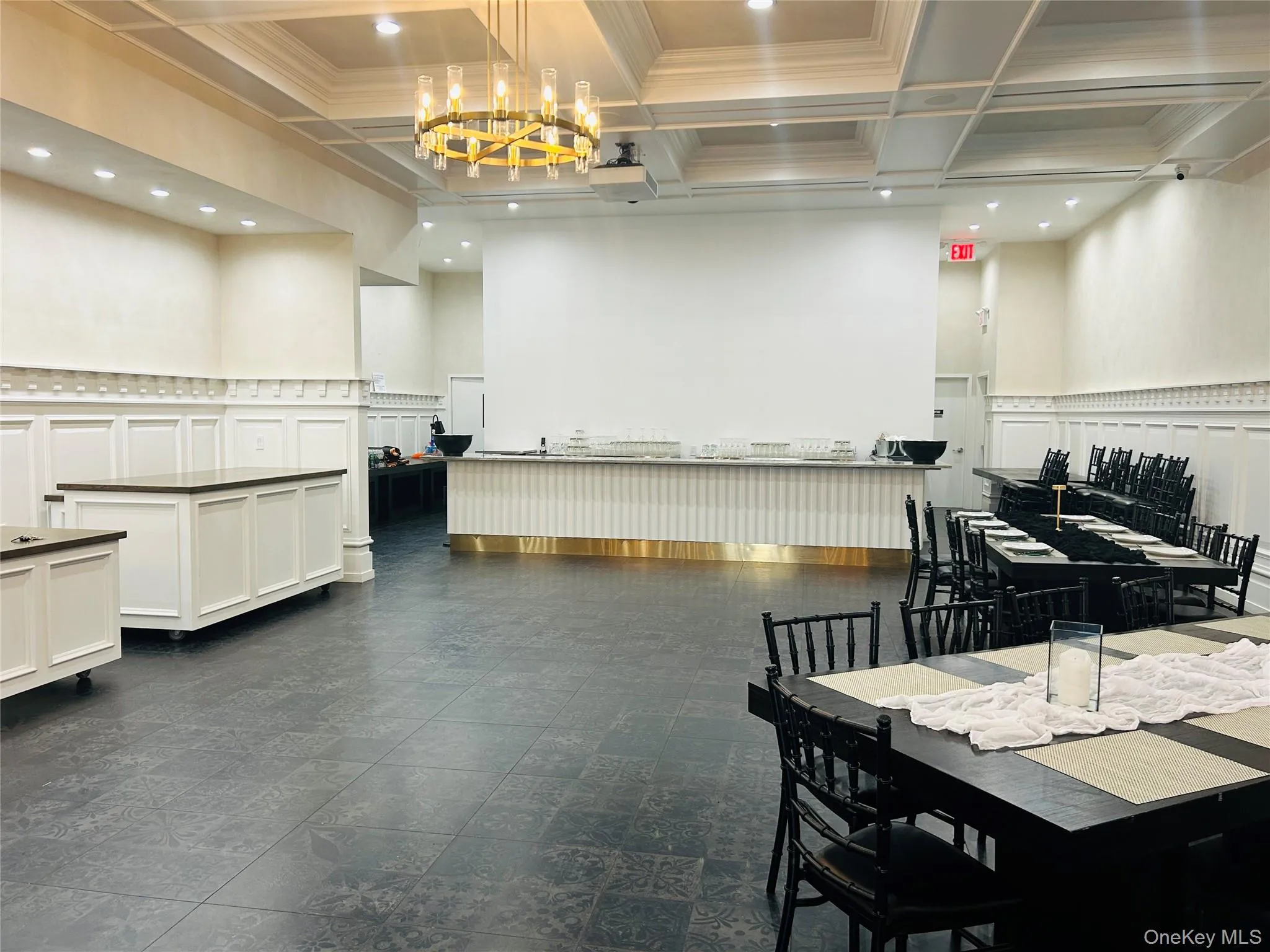 Dining room with coffered ceiling, recessed lighting, beam ceiling, ornamental molding, and a towering ceiling Dining room with coffered ceiling, recessed lighting, beam ceiling, ornamental molding, and a towering ceiling