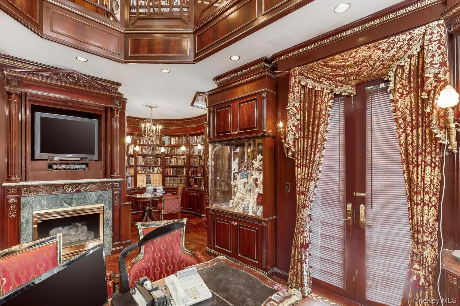 Office featuring french doors, a chandelier, a high end fireplace, and recessed lighting Office featuring french doors, a chandelier, a high end fireplace, and recessed lighting