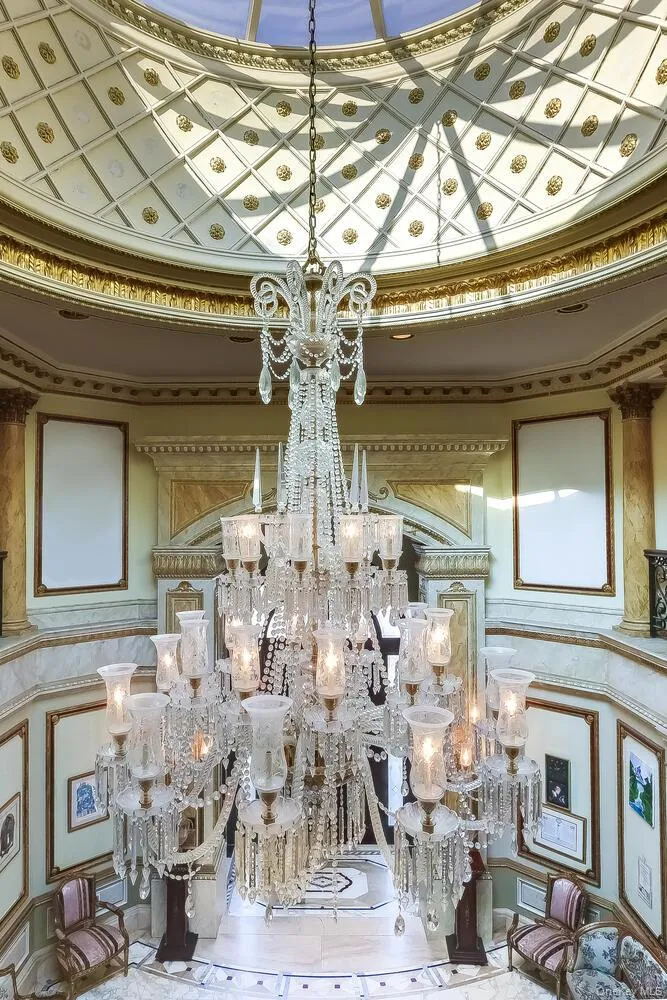 Detailed view of a chandelier and crown molding Detailed view of a chandelier and crown molding