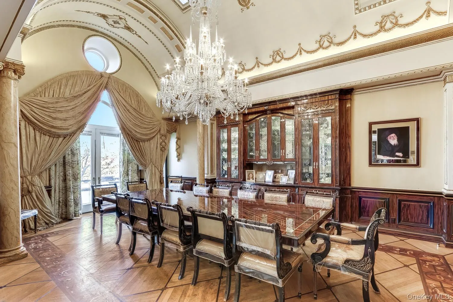 Barrel vaulted dining room ceiling, chandelier, inlaid floor detail, wainscoting Barrel vaulted dining room ceiling, chandelier, inlaid floor detail, wainscoting