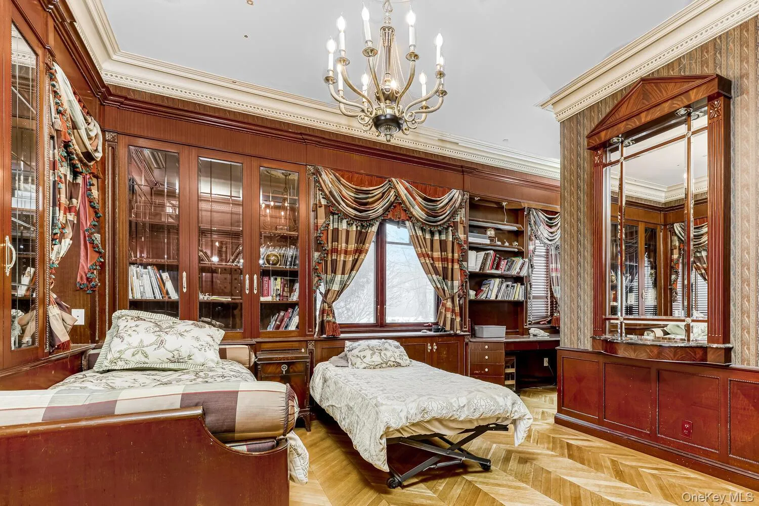 Sitting room featuring ornamental molding and a chandelier Sitting room featuring ornamental molding and a chandelier