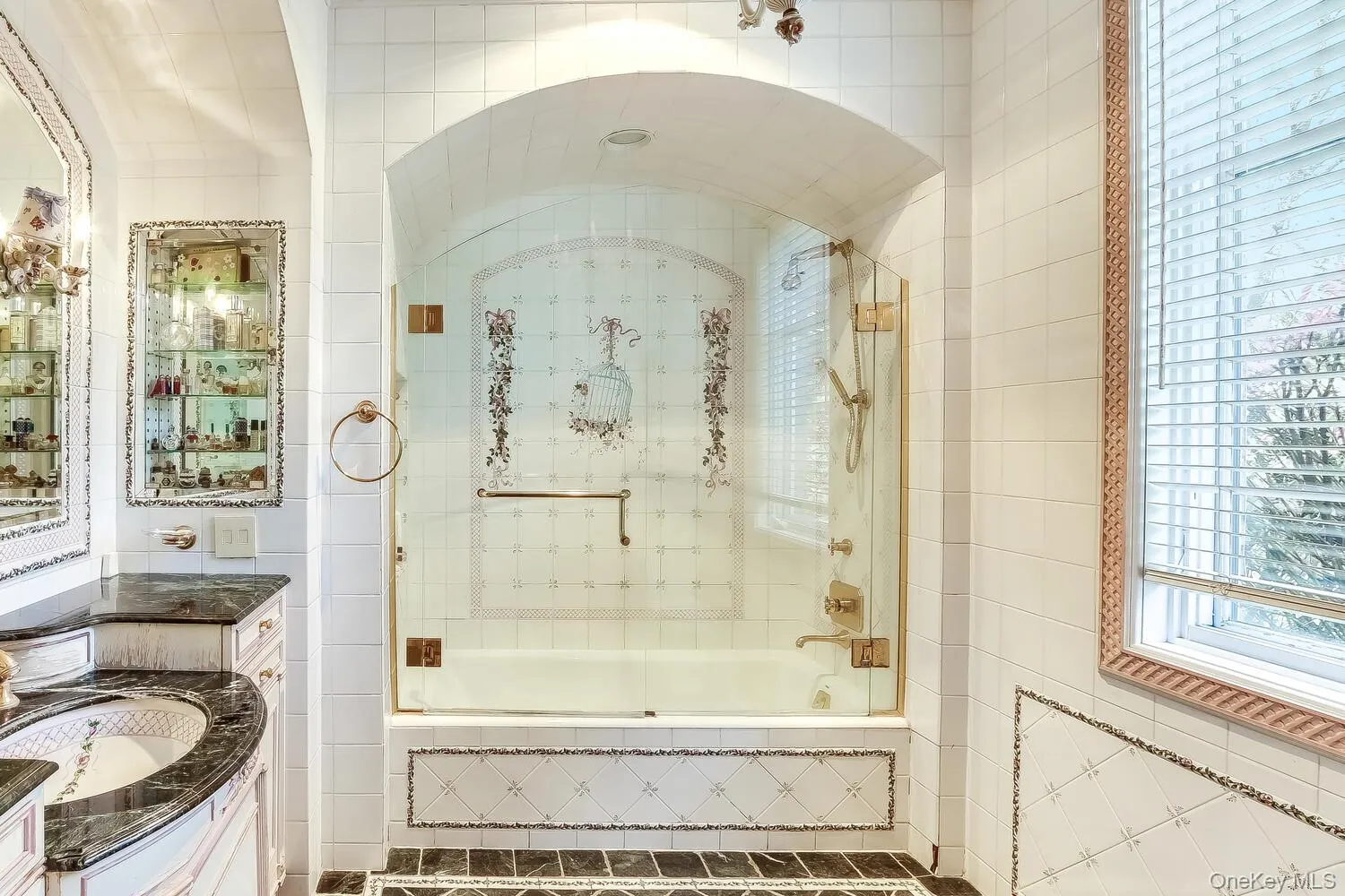 Bathroom with tiled shower / bath, vanity, and tile walls Bathroom with tiled shower / bath, vanity, and tile walls