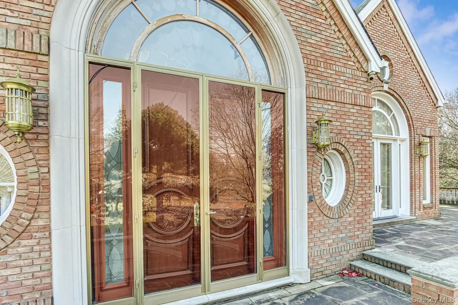 Entrance to property featuring brick siding Entrance to property featuring brick siding