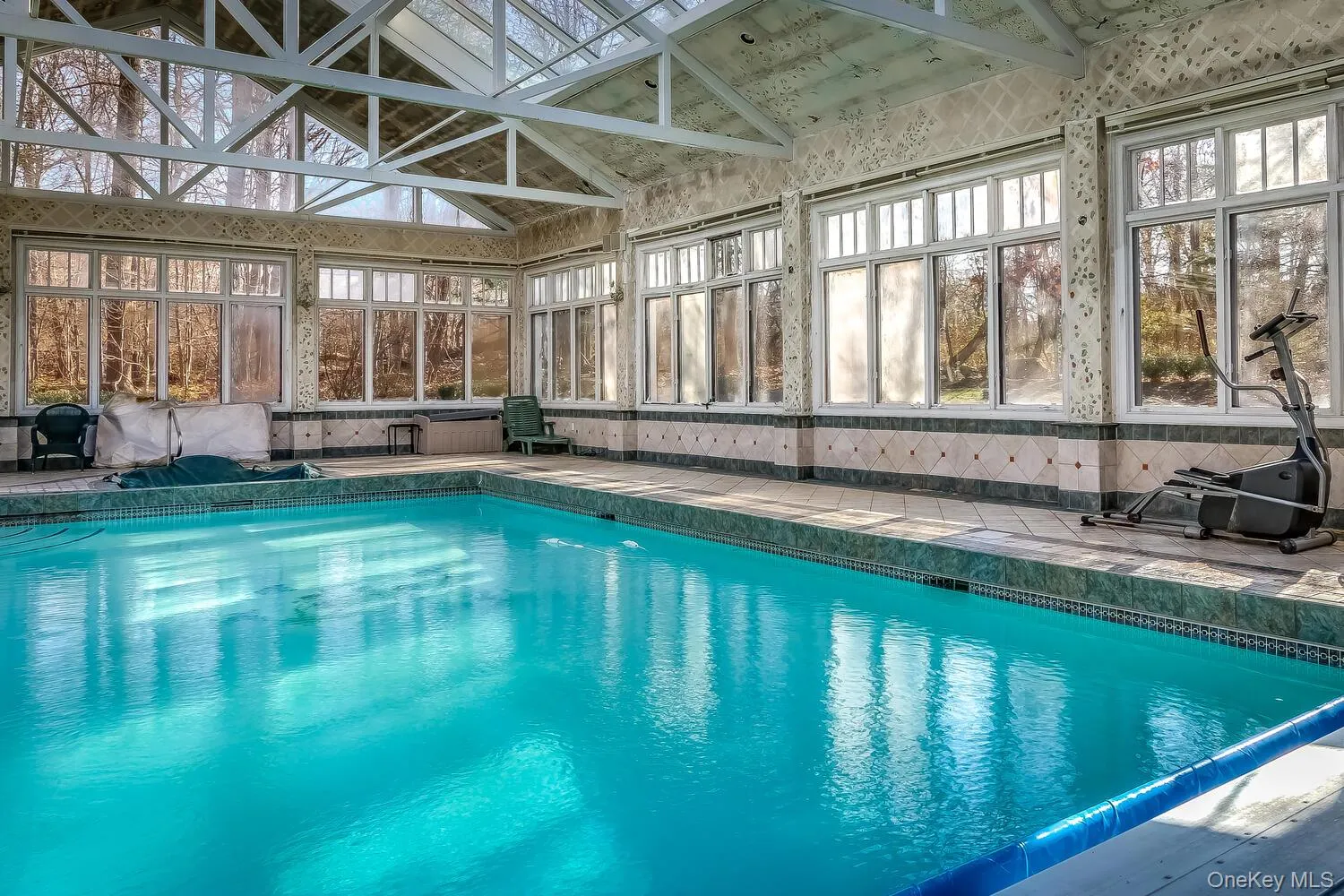 Indoor pool with a sunroom Indoor pool with a sunroom