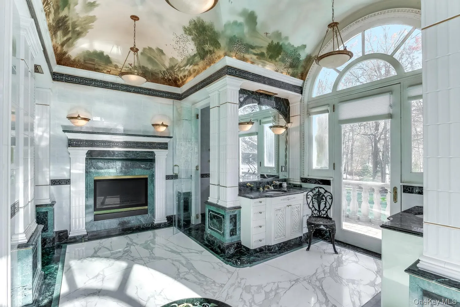 Full bathroom featuring marble tiled flooring, vanity, a premium fireplace, and vaulted ceiling Full bathroom featuring marble tiled flooring, vanity, a premium fireplace, and vaulted ceiling