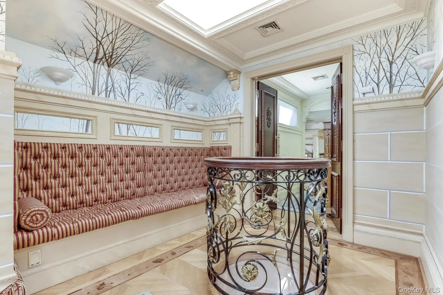 Hallway with crown molding and wallpapered walls Hallway with crown molding and wallpapered walls