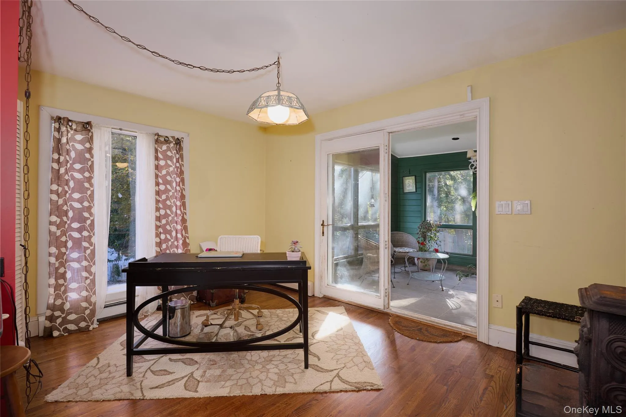 Office with healthy amount of natural light and wood finished floors Office with healthy amount of natural light and wood finished floors