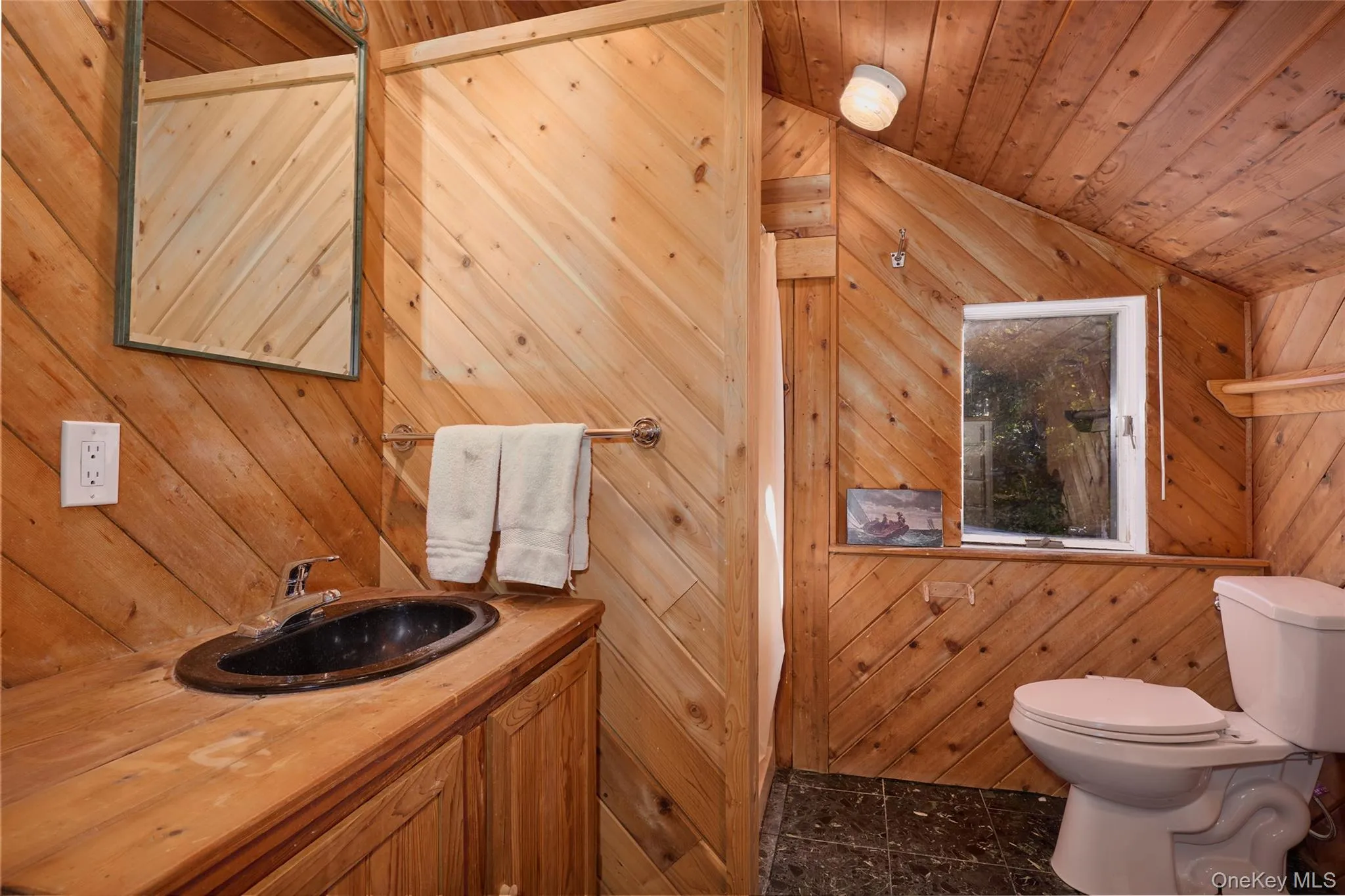 Upstairs Bedroom Full bath featuring vanity, wood walls, and wood ceiling Upstairs Bedroom Full bath featuring vanity, wood walls, and wood ceiling