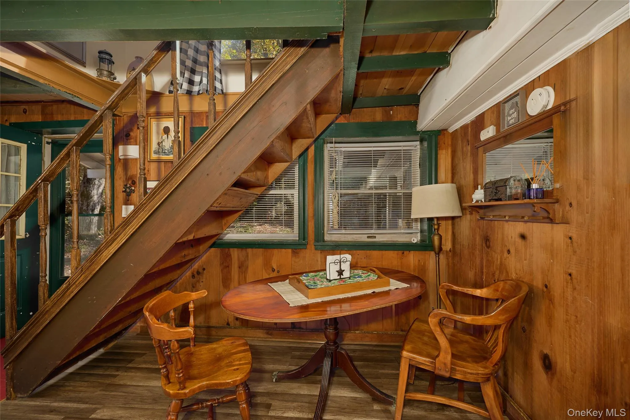Cottage Dining area, with stairs to Bedroom and upper deck Cottage Dining area, with stairs to Bedroom and upper deck