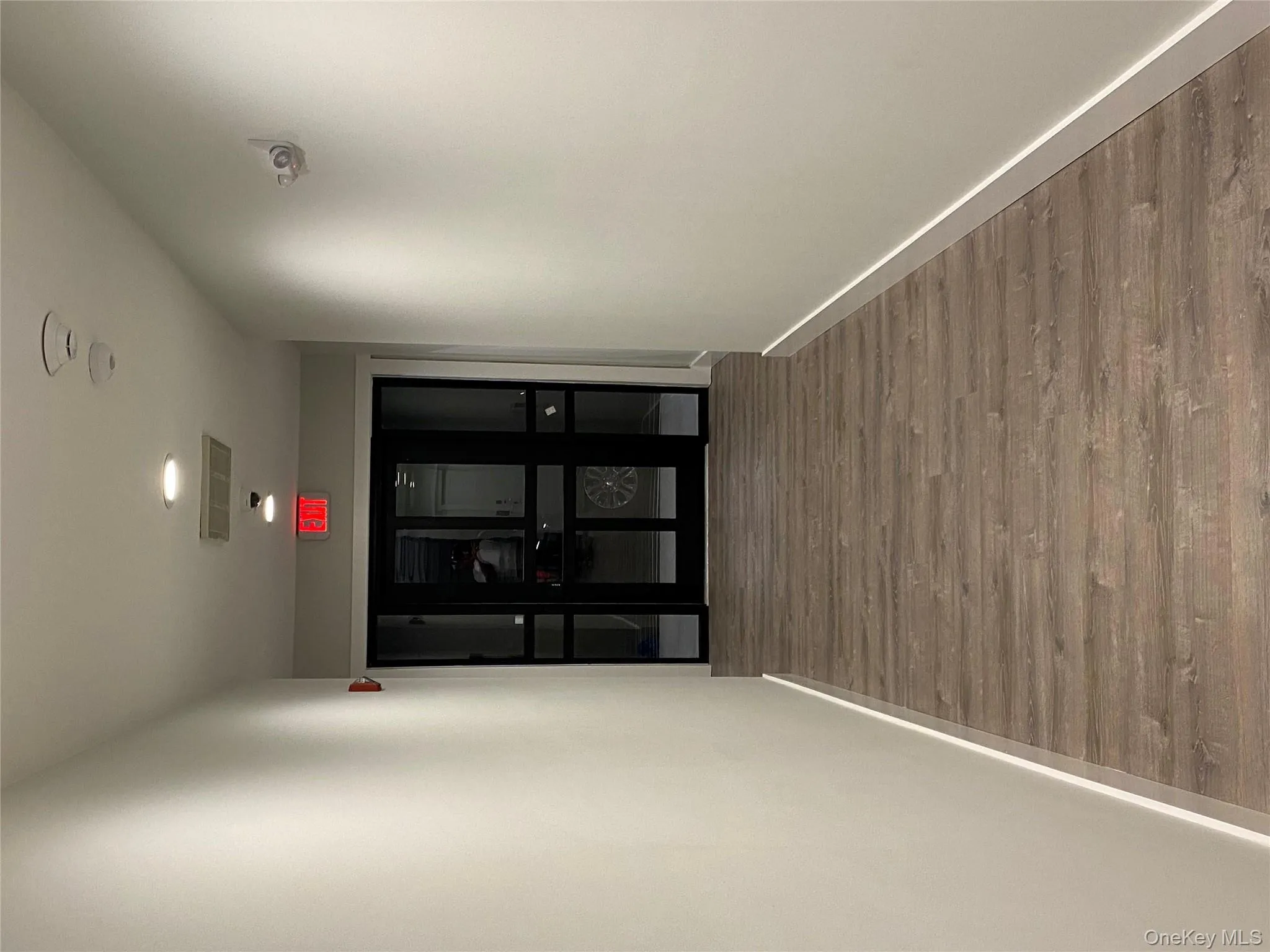 Hall with wood finished floors and baseboards Hall with wood finished floors and baseboards