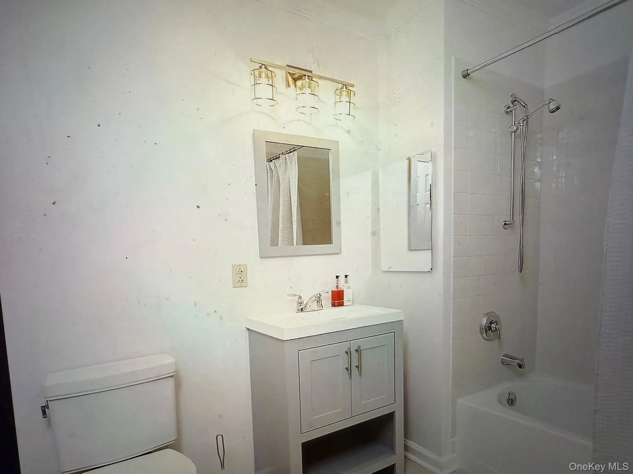 Full bath with shower / bath combo with shower curtain and vanity Full bath with shower / bath combo with shower curtain and vanity