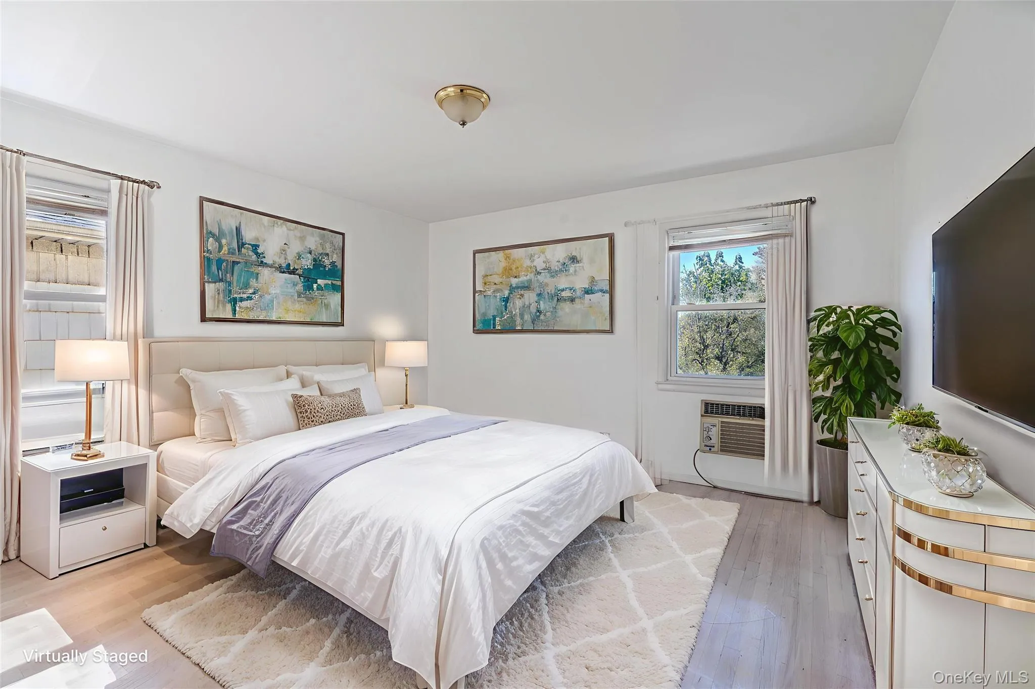 Bedroom featuring light wood finished floors Bedroom featuring light wood finished floors