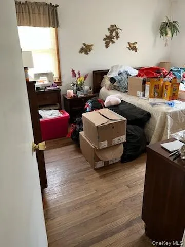 Bedroom with hardwood / wood-style flooring Bedroom with hardwood / wood-style flooring