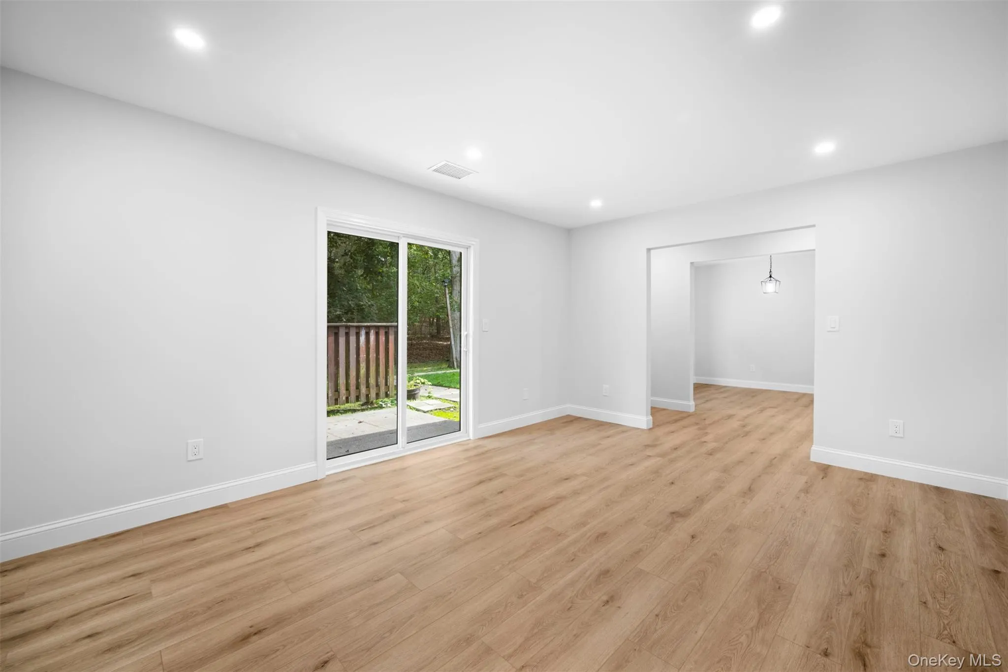 Spare room featuring light wood-style floors and recessed lighting Spare room featuring light wood-style floors and recessed lighting