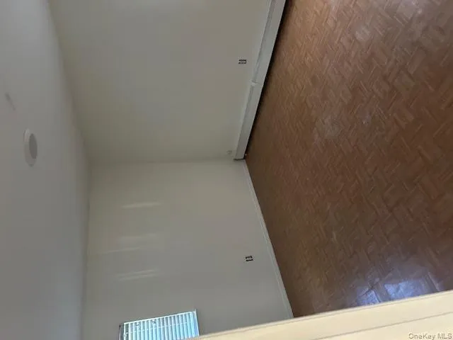 Unfurnished room featuring a baseboard heating unit and baseboards Unfurnished room featuring a baseboard heating unit and baseboards