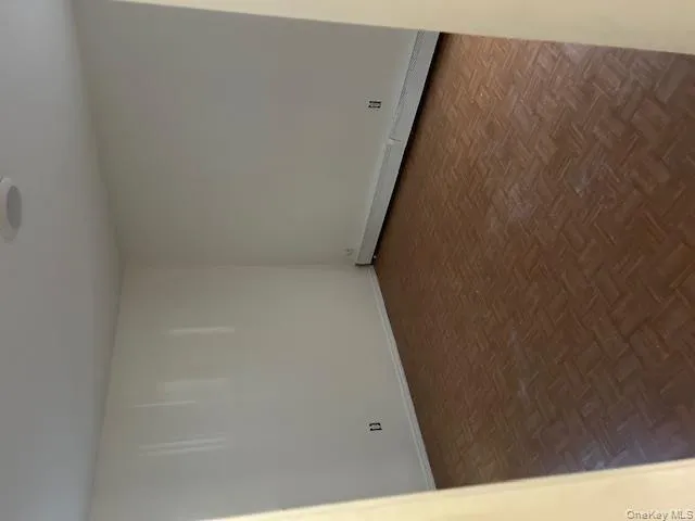 Spare room with a baseboard heating unit and baseboards Spare room with a baseboard heating unit and baseboards