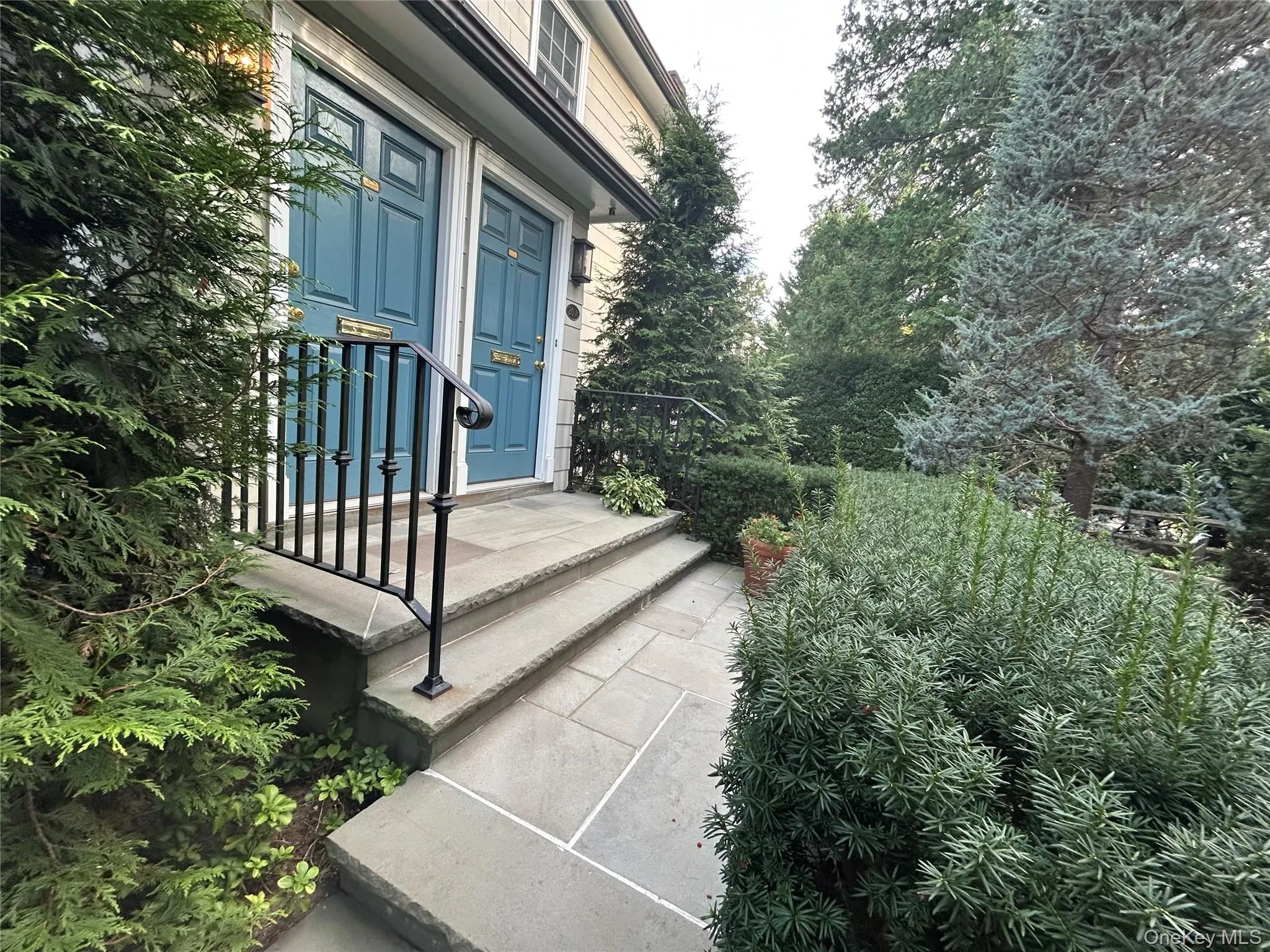 Entrance to property featuring view of scattered trees Entrance to property featuring view of scattered trees