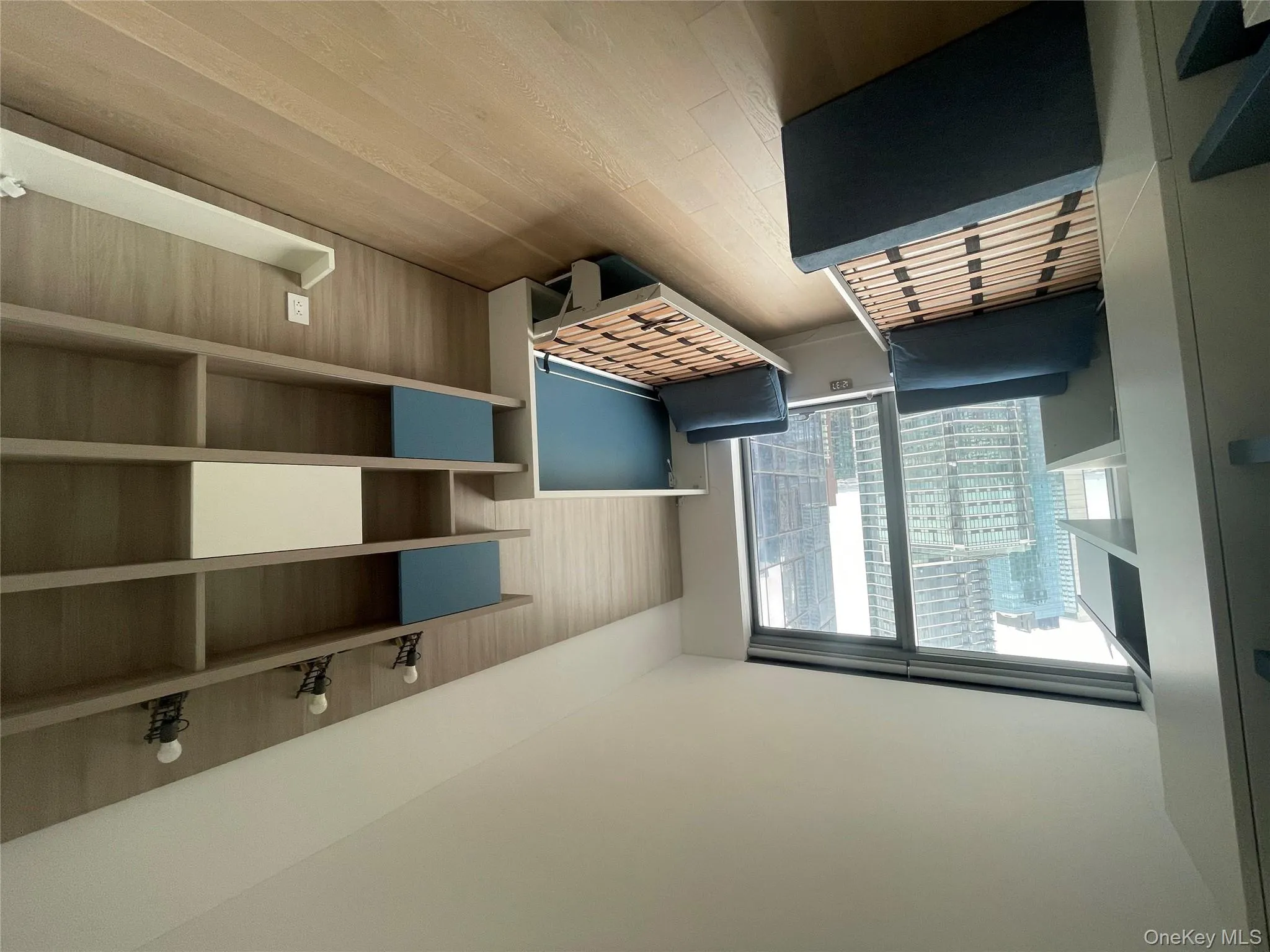 Bedroom featuring light wood-style flooring and baseboards Bedroom featuring light wood-style flooring and baseboards