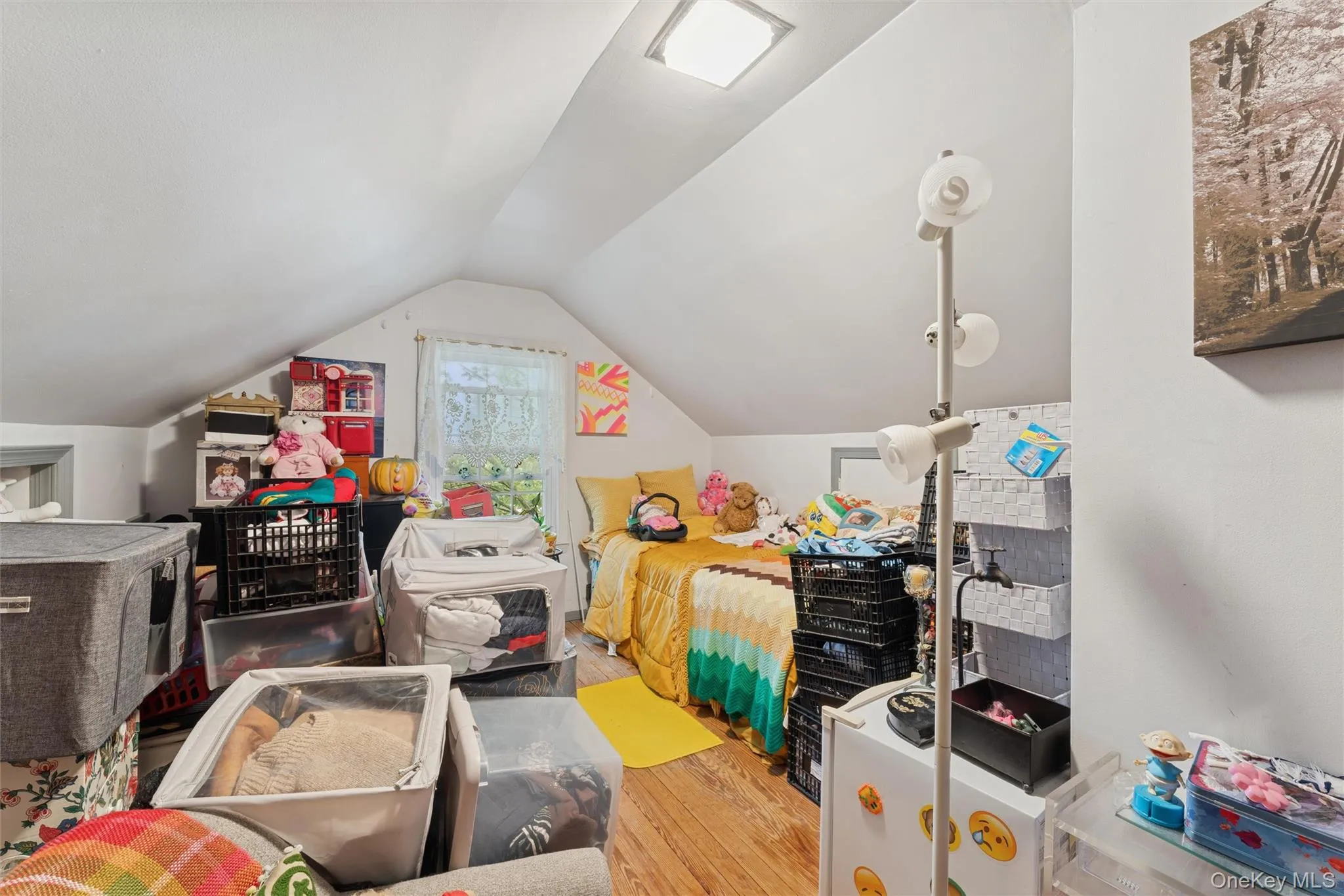 Rec room featuring lofted ceiling and wood finished floors Rec room featuring lofted ceiling and wood finished floors