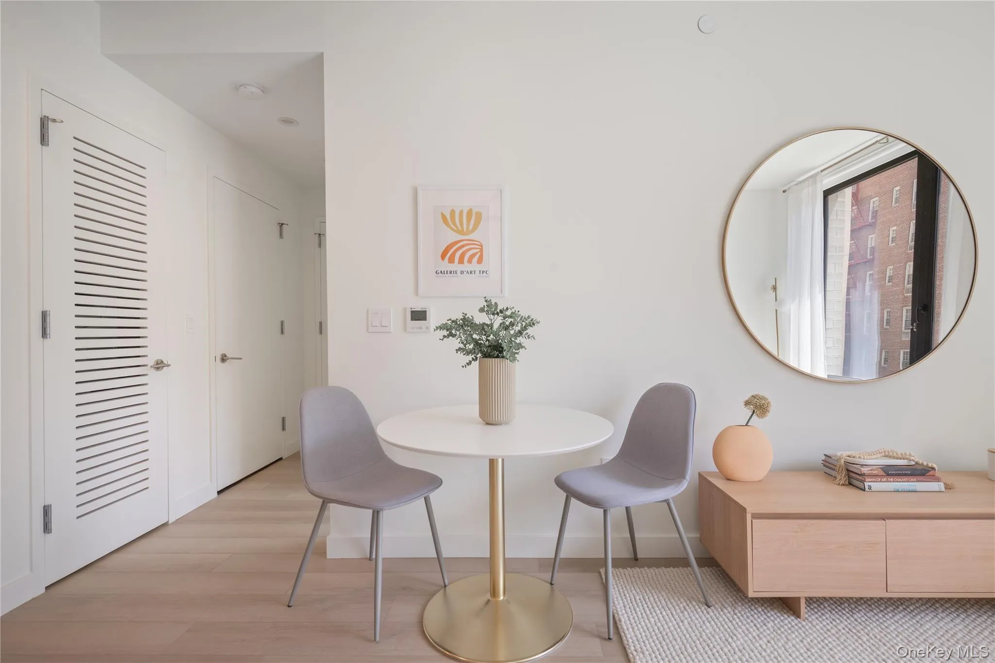 Dining area with light wood-style flooring and baseboards Dining area with light wood-style flooring and baseboards