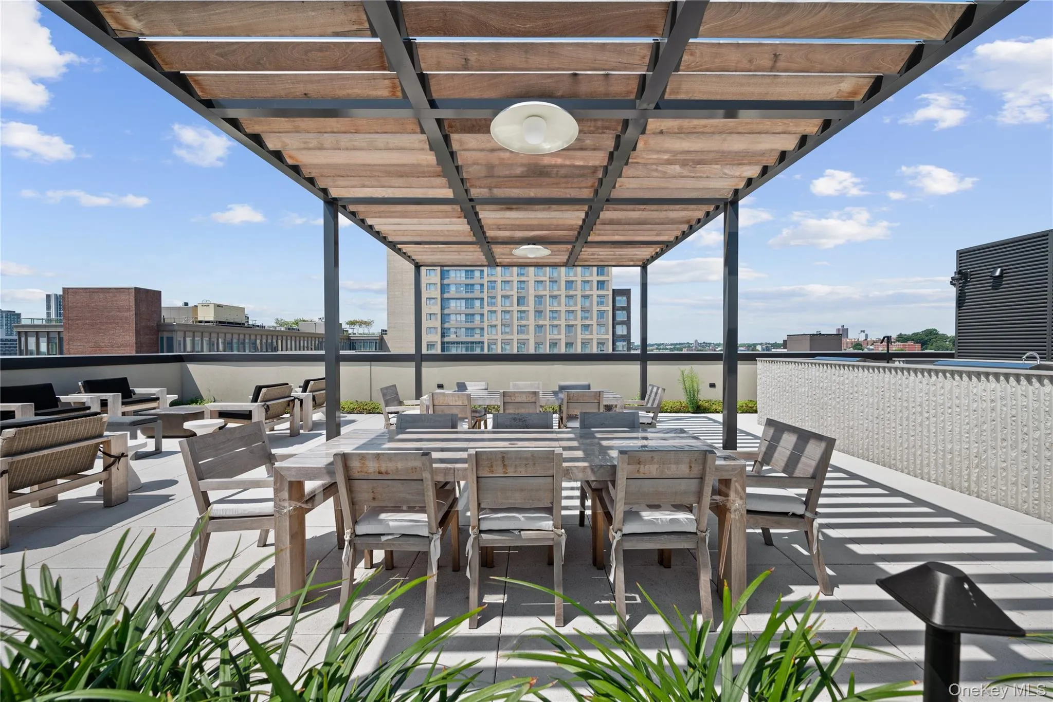View of patio with outdoor dining space, a view of city, and outdoor lounge area View of patio with outdoor dining space, a view of city, and outdoor lounge area