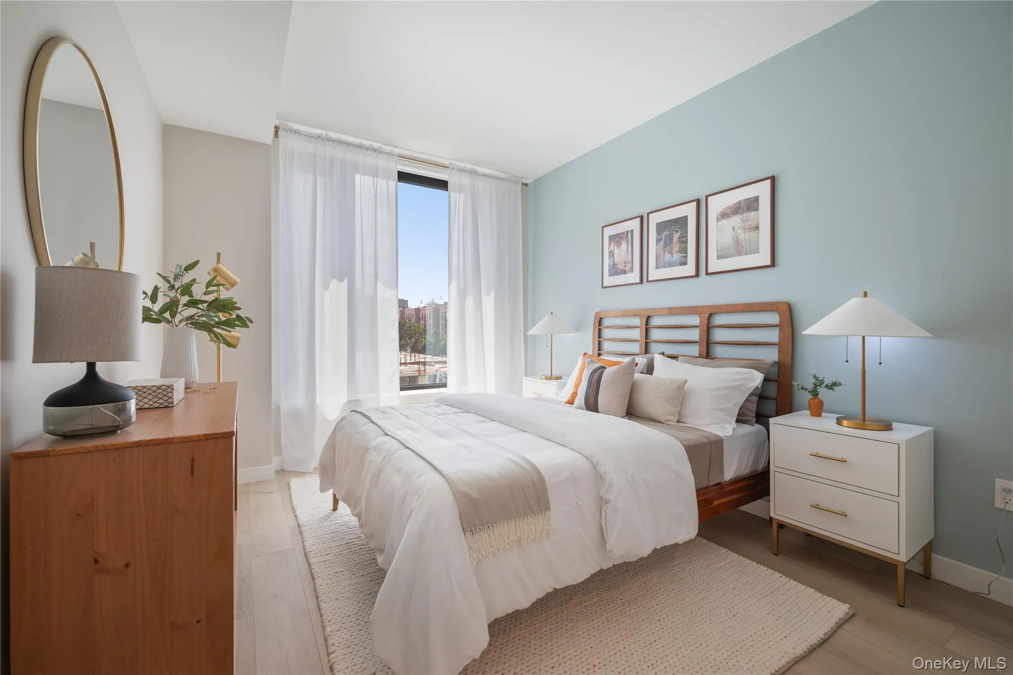 Bedroom with light wood-style floors and baseboards Bedroom with light wood-style floors and baseboards