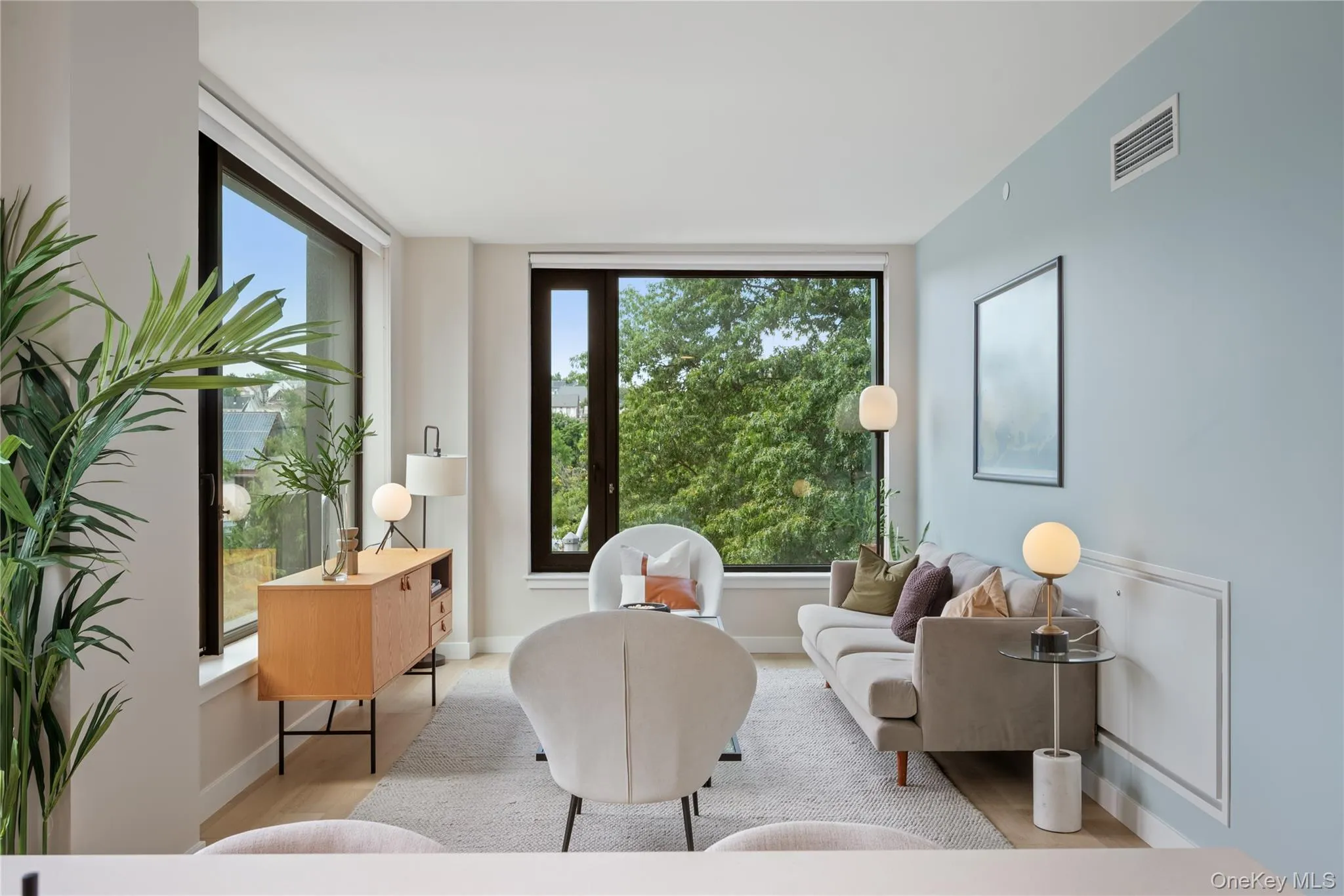 Sitting room with healthy amount of natural light and wood finished floors Sitting room with healthy amount of natural light and wood finished floors