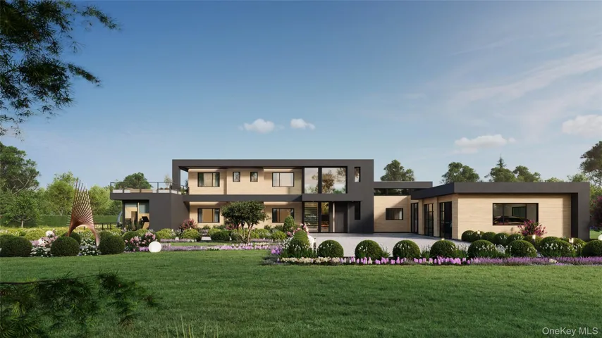 A striking modern façade defined by clean architectural lines, layered landscaping, and a custom pivot entry. The attached two-car garage is seamlessly integrated into the design, balancing form and function with understated elegance.