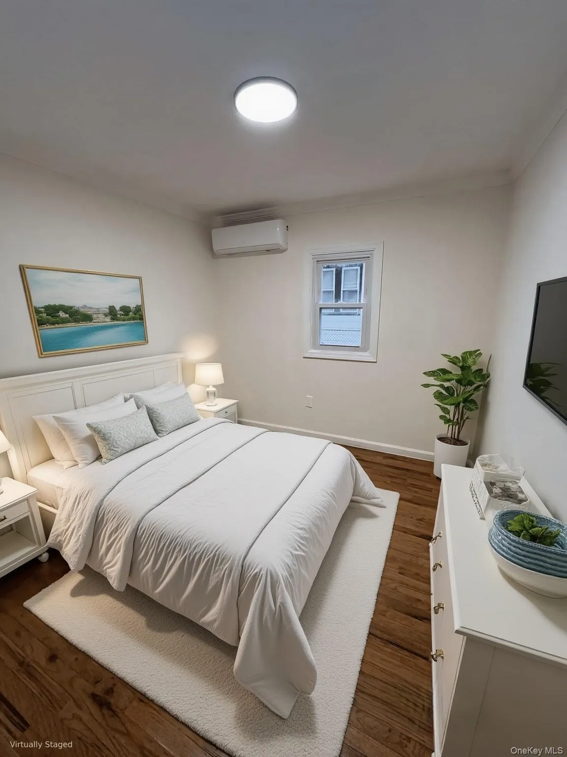 Bedroom featuring dark wood-style floors, a wall unit AC, and crown molding Bedroom featuring dark wood-style floors, a wall unit AC, and crown molding