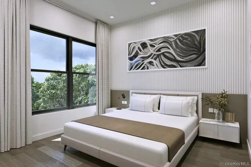 Bedroom with dark hardwood / wood-style flooring Bedroom with dark hardwood / wood-style flooring