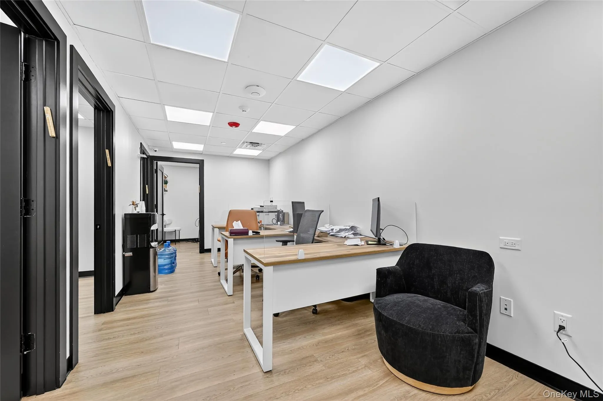 Home office with a paneled ceiling Home office with a paneled ceiling