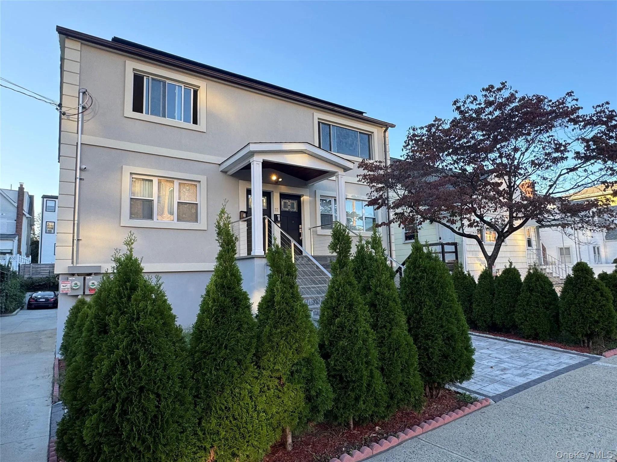 Traditional-style house featuring stucco siding Traditional-style house featuring stucco siding