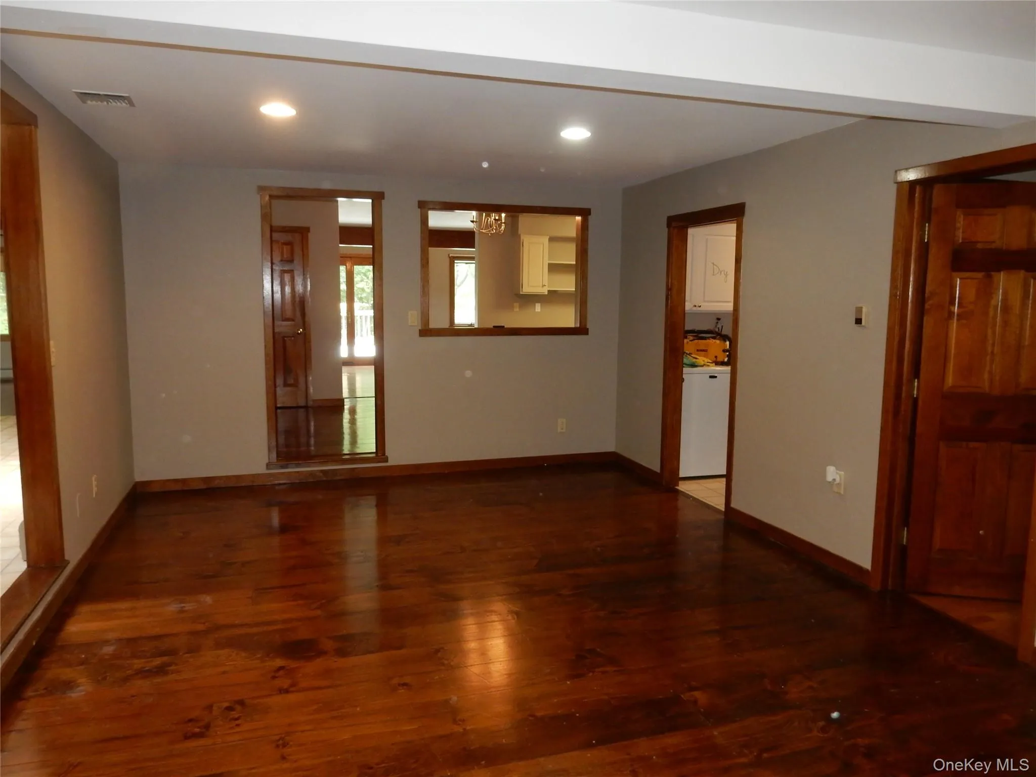 Unfurnished room featuring hardwood / wood-style flooring and recessed lighting Unfurnished room featuring hardwood / wood-style flooring and recessed lighting