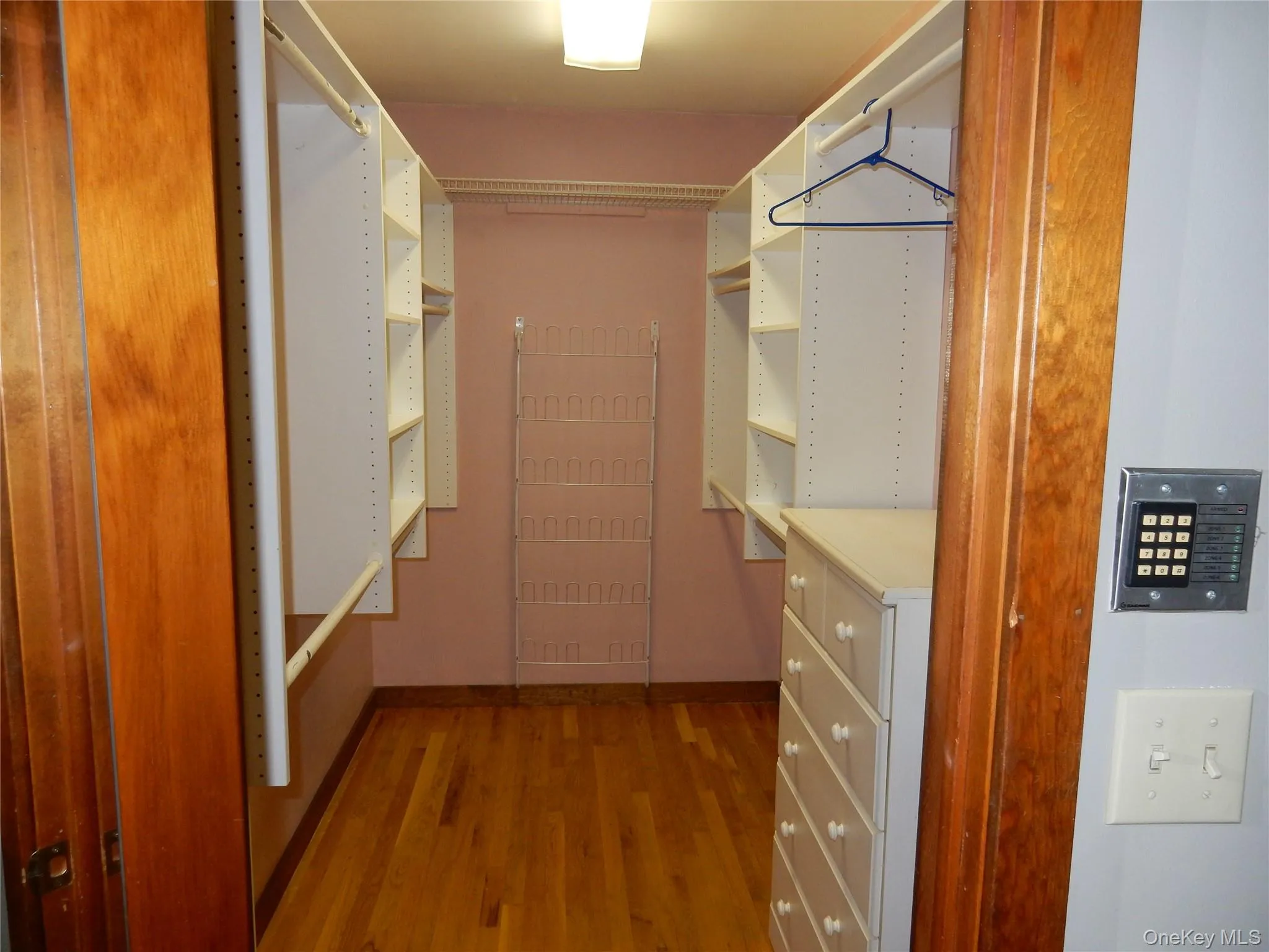 Spacious closet featuring wood finished floors Spacious closet featuring wood finished floors